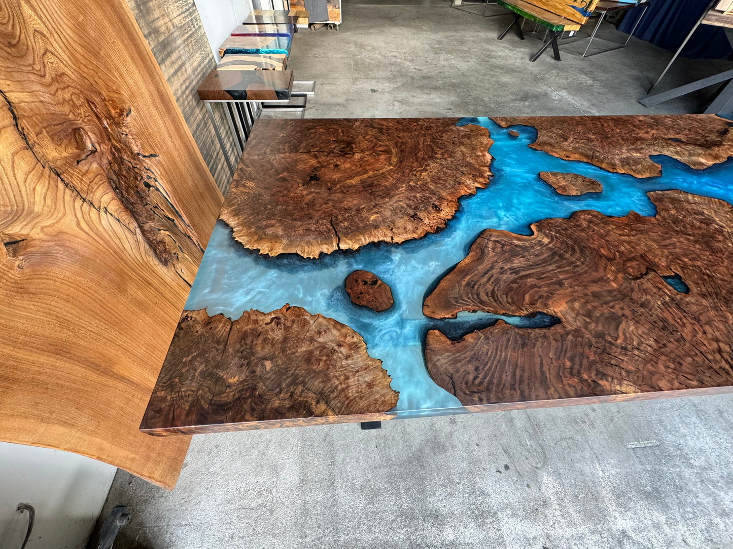 Claro Walnut Burl Dining Table with Multi-Blue Epoxy Encasement