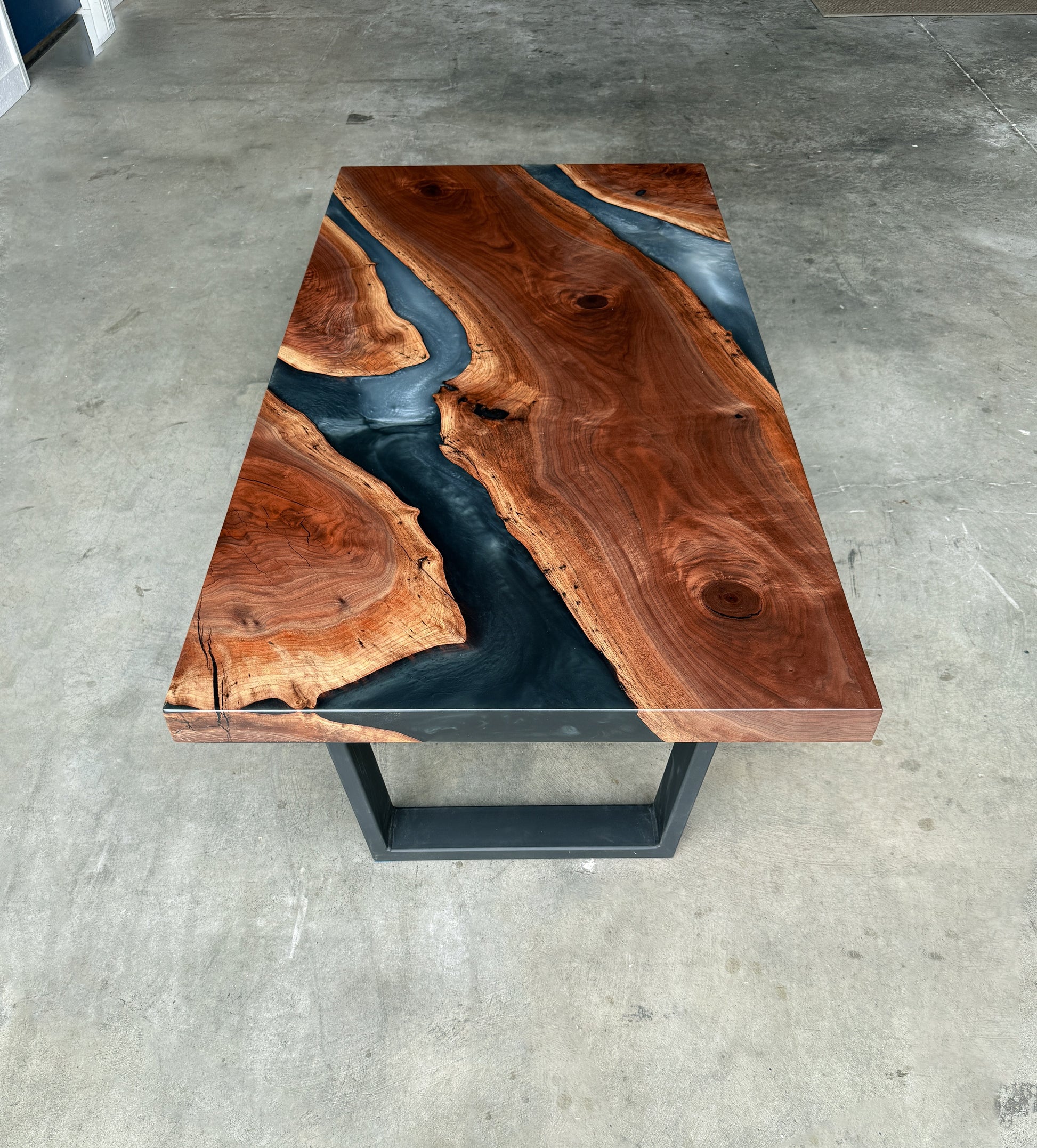 Black walnut river coffee table with multi-grey epoxy resin and black angled square metal legs