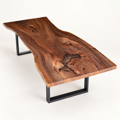 Black walnut live edge slab dining table with espresso resin fills and black steel legs on a warm-white background.