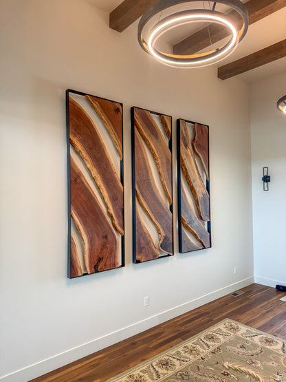 Side view of black walnut wall sculpture with open space behind the live-edge slabs