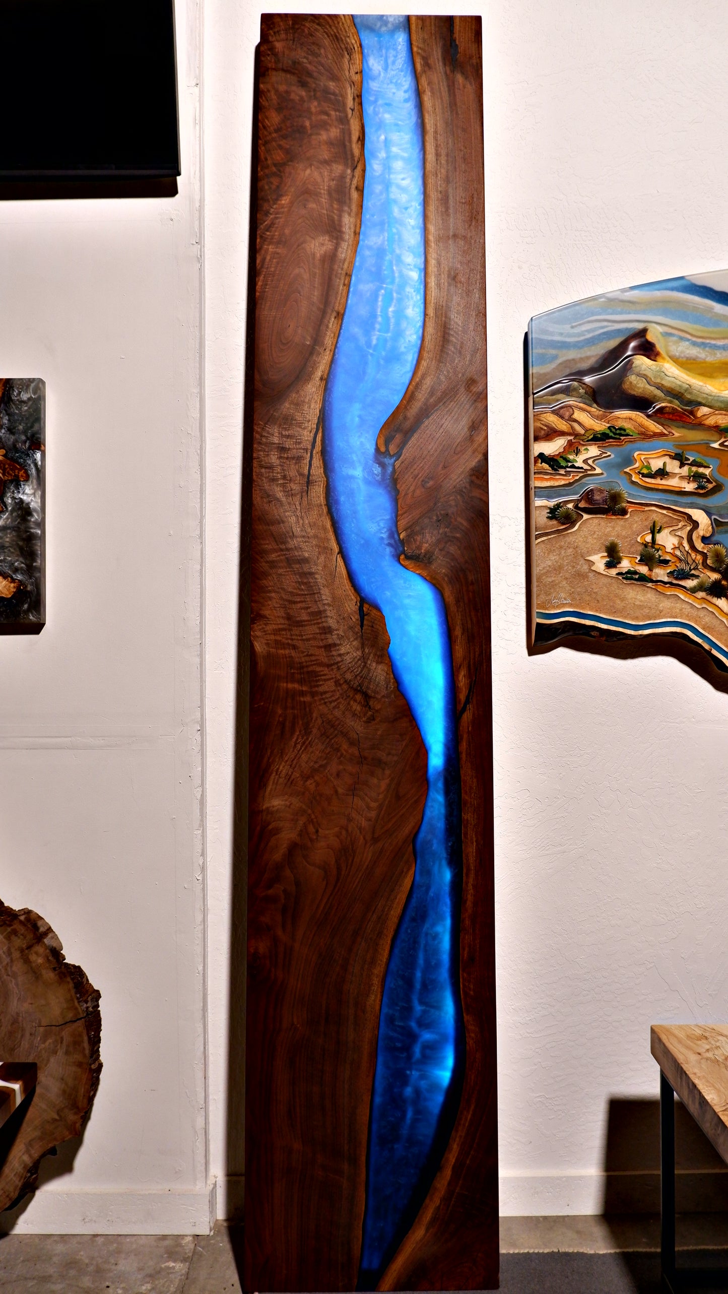 Custom black walnut and epoxy waterfall wall art with integrated LED lighting