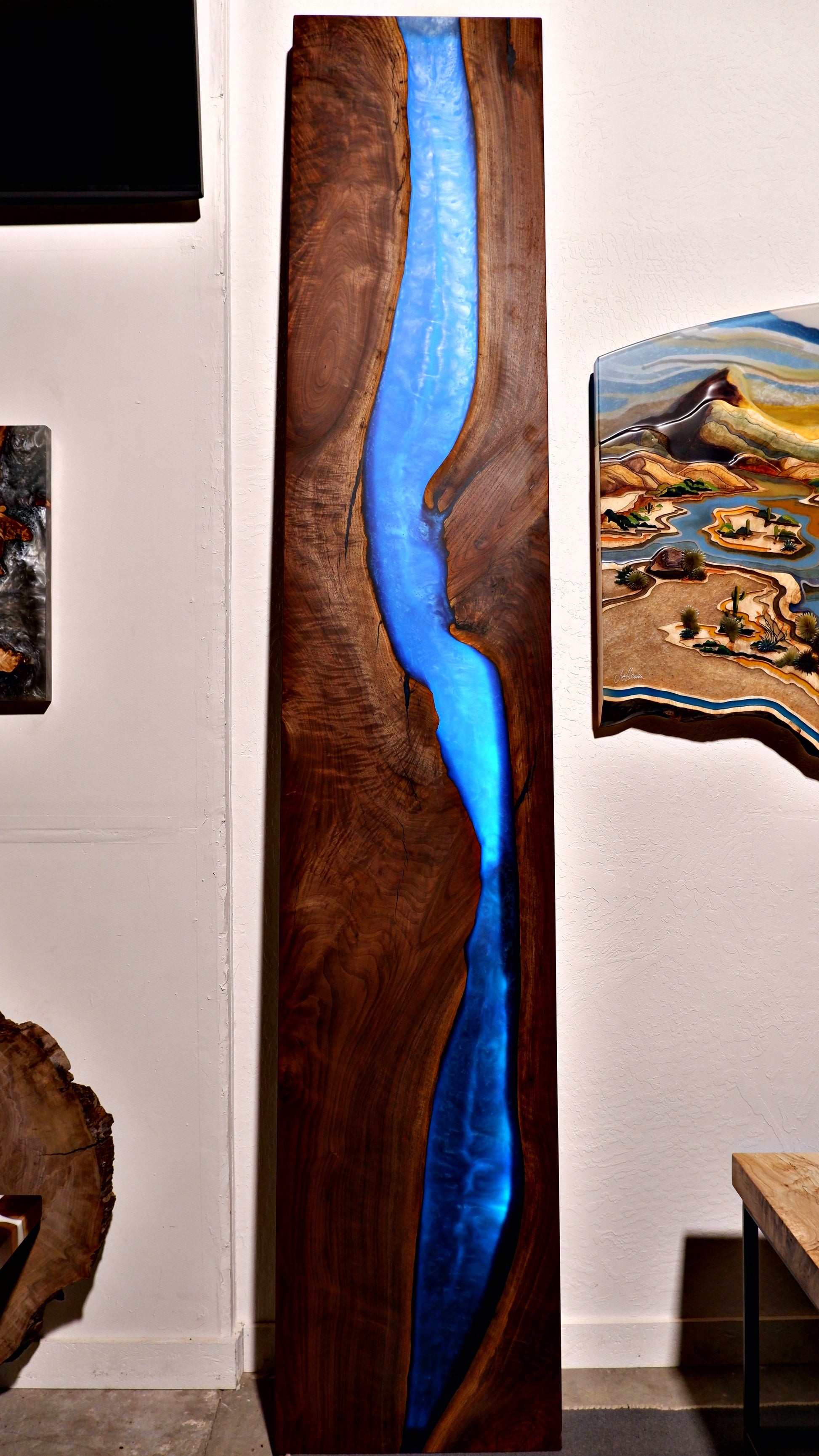 Custom black walnut and epoxy waterfall wall art with integrated LED lighting