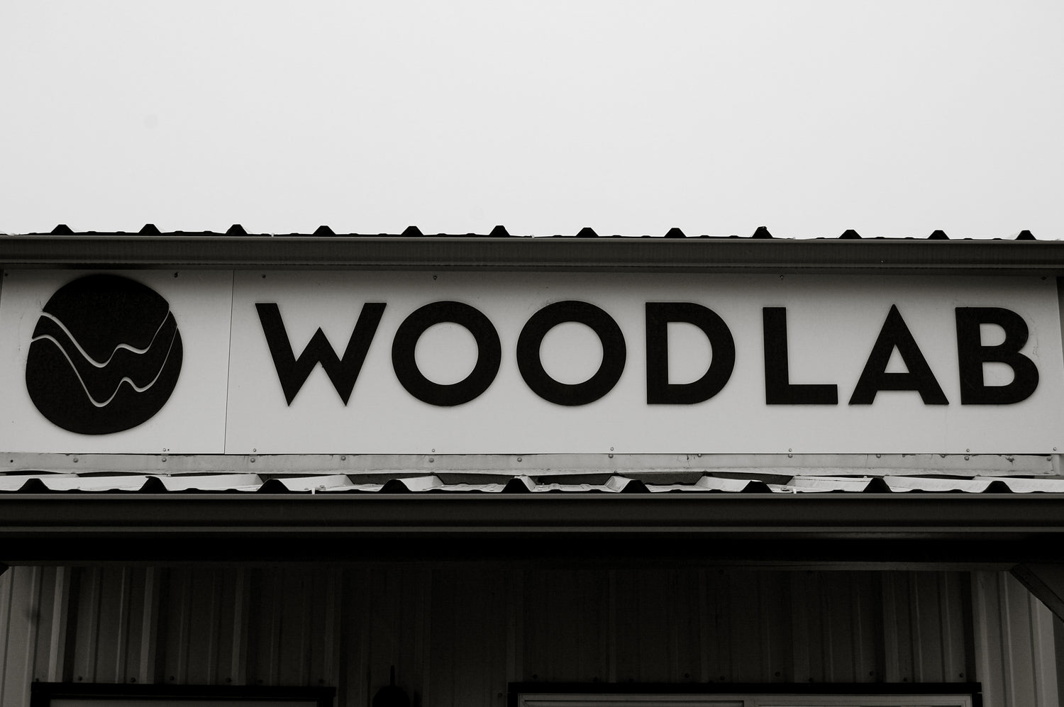 Black and White image of Woodlab sign